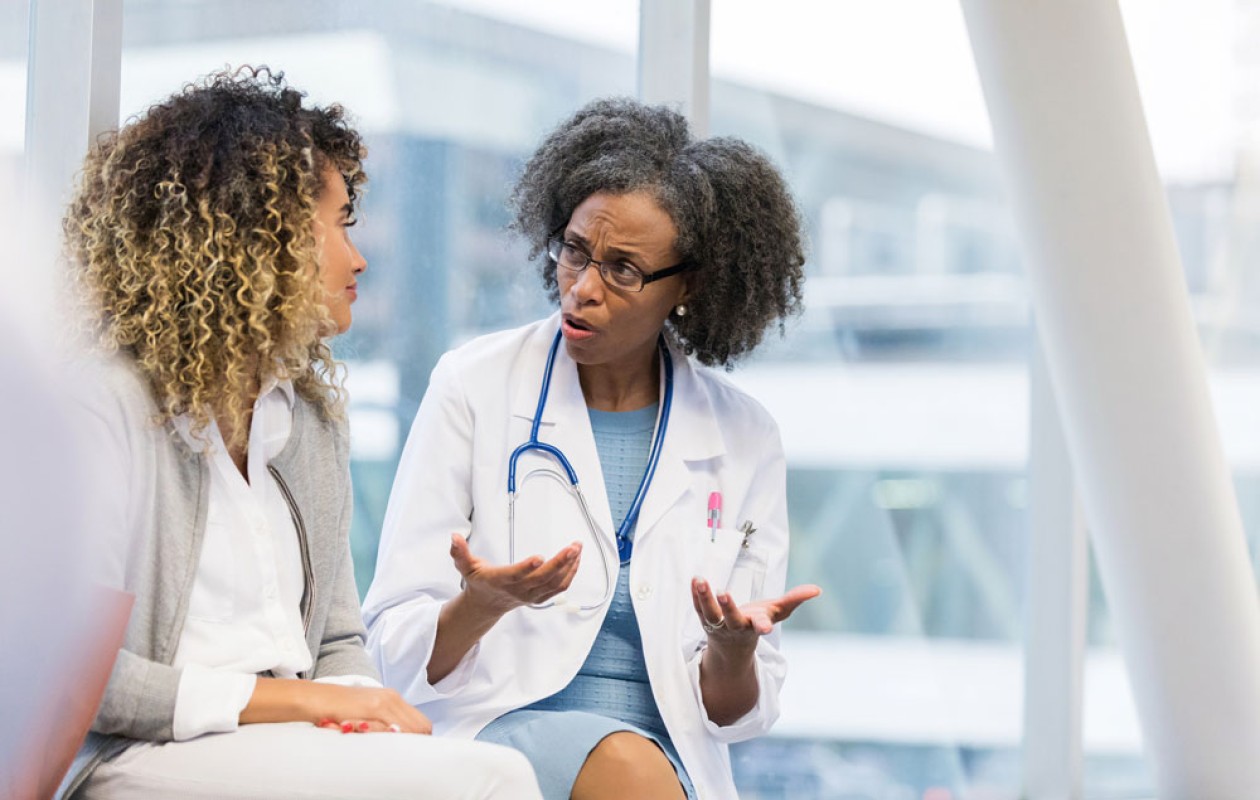 Doctor talking with other woman