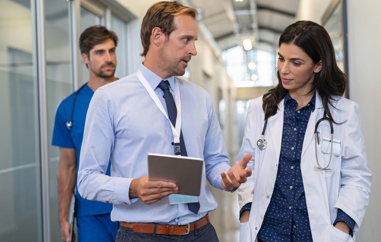 Two doctors talking together in an hospital corridor