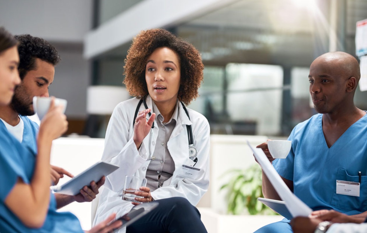 Doctor talking with nurses