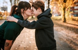 Woman kissing a boy on the nose