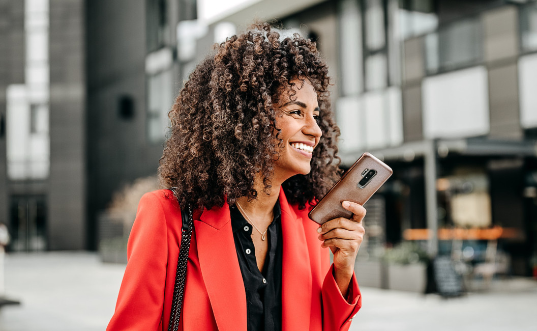 A healthy and happy woman with a cellphone